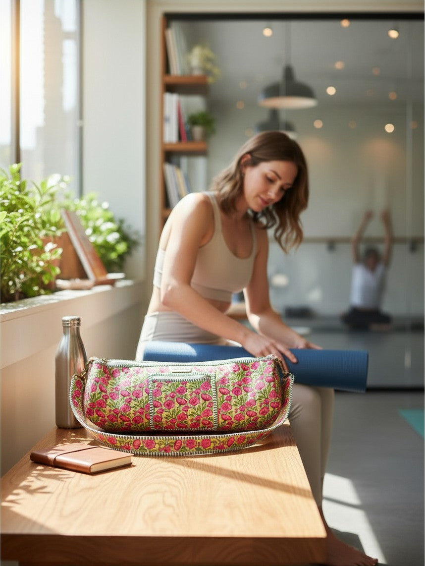 Wild Lotus UK quilted cotton yoga mat bag with floral print, green striped trim, and adjustable shoulder strap.