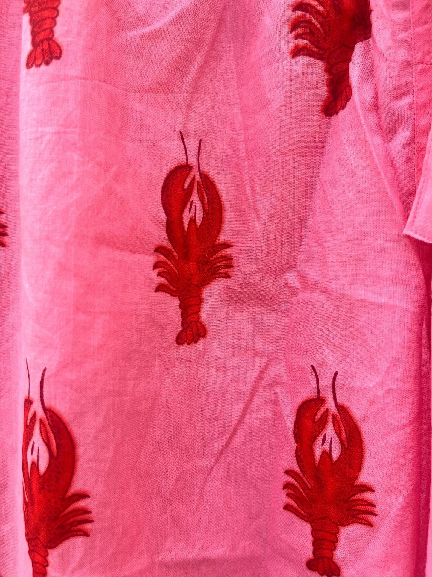 Wild Lotus UK pink cotton sleep shorts featuring a playful red lobster block print pattern.